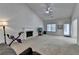 Spacious living room boasts a cozy fireplace, neutral carpet, and lots of natural light at 2790 Meadow Gate Way, Loganville, GA 30052