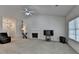 Spacious living room boasts a cozy fireplace, neutral carpet, and lots of natural light at 2790 Meadow Gate Way, Loganville, GA 30052