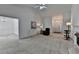 Spacious living room boasts a cozy fireplace, neutral carpet, and lots of natural light at 2790 Meadow Gate Way, Loganville, GA 30052