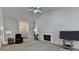 Spacious living room boasts a cozy fireplace, neutral carpet, and lots of natural light at 2790 Meadow Gate Way, Loganville, GA 30052