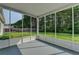 A screened porch with an open view of the well maintained backyard at 2790 Meadow Gate Way, Loganville, GA 30052