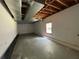 Unfinished basement area with a window for light at 3840 Whitaker Ln, Lithia Springs, GA 30122