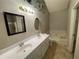 Main bathroom featuring a double vanity and a jacuzzi tub at 3840 Whitaker Ln, Lithia Springs, GA 30122