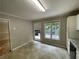 Open-concept kitchen and breakfast area with a door to the deck at 3840 Whitaker Ln, Lithia Springs, GA 30122