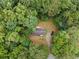 Aerial view of a home nestled among trees, showcases its private and secluded setting at 1010 Martin Ln, Canton, GA 30114