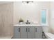Bathroom featuring a gray vanity, modern fixtures, and a glass-enclosed shower at 1010 Martin Ln, Canton, GA 30114