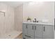 Bathroom featuring a gray vanity, modern fixtures, and a glass-enclosed shower at 1010 Martin Ln, Canton, GA 30114