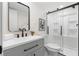 Updated bathroom with a sleek vanity, modern fixtures, and glass shower at 1010 Martin Ln, Canton, GA 30114
