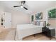 Bright bedroom featuring a ceiling fan, natural light, and modern decor at 1010 Martin Ln, Canton, GA 30114