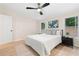 Bright bedroom featuring a ceiling fan, natural light, and modern decor at 1010 Martin Ln, Canton, GA 30114