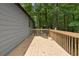 Wooden deck overlooking a wooded area, perfect for relaxing and enjoying nature at 1010 Martin Ln, Canton, GA 30114
