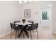 Dining area featuring a round table, modern decor, and view of the front yard at 1010 Martin Ln, Canton, GA 30114