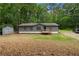 Charming single-story home with a gray exterior and a welcoming front porch at 1010 Martin Ln, Canton, GA 30114