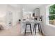 Eat-in kitchen featuring modern appliances, breakfast bar, and easy access to other rooms at 1010 Martin Ln, Canton, GA 30114