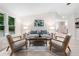 Bright living room features two chairs, hardwood floors, and stylish contemporary furniture at 1010 Martin Ln, Canton, GA 30114
