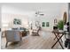 Bright living room features a fireplace, hardwood floors, and stylish contemporary furniture at 1010 Martin Ln, Canton, GA 30114