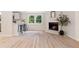 Living room features hardwood floors, fireplace, and a great view of the lush backyard at 1010 Martin Ln, Canton, GA 30114