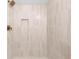 Shower featuring vertical tiles, rain shower head, and a built in soap nook at 1010 Martin Ln, Canton, GA 30114
