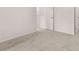 Bedroom with neutral carpet, white walls, and ample natural light from a large window at 1406 Gray Branch Dr, Lawrenceville, GA 30045