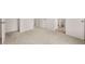 Spacious bedroom with carpet and doors leading to other rooms and bathroom, designed for comfort and accessibility at 1406 Gray Branch Dr, Lawrenceville, GA 30045