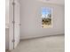 Bedroom with a large window, neutral carpet, and white walls provides a serene, bright living space at 1406 Gray Branch Dr, Lawrenceville, GA 30045