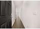 A bright hallway with dark wooden floors leads to the main living areas of the home at 1406 Gray Branch Dr, Lawrenceville, GA 30045
