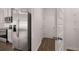 Modern kitchen boasts stainless steel appliances including a refrigerator and range with gray cabinets at 1406 Gray Branch Dr, Lawrenceville, GA 30045