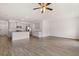 Open-concept living space with kitchen featuring grey cabinets, granite countertops, and stainless appliances at 1406 Gray Branch Dr, Lawrenceville, GA 30045