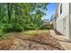 Spacious backyard featuring a wooden deck and lush greenery, perfect for outdoor entertaining and relaxation at 160 Pine Grove Dr, Canton, GA 30114