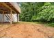 View of the expansive backyard, wooden deck, and surrounding lush greenery, ideal for outdoor activities at 160 Pine Grove Dr, Canton, GA 30114
