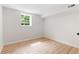 A bright unfinished basement featuring a window and freshly painted white interior walls at 160 Pine Grove Dr, Canton, GA 30114