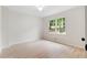 Bright bedroom with natural light from a large window and light wood-look flooring at 160 Pine Grove Dr, Canton, GA 30114