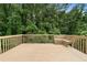 Spacious wooden deck with built-in bench seating, perfect for relaxing and enjoying the outdoors at 160 Pine Grove Dr, Canton, GA 30114