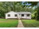 Charming renovated home featuring a landscaped yard and inviting front porch at 160 Pine Grove Dr, Canton, GA 30114