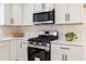 Modern kitchen features a stainless steel range and microwave at 160 Pine Grove Dr, Canton, GA 30114