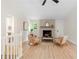 Cozy living room features a fireplace, modern decor and ample natural light at 160 Pine Grove Dr, Canton, GA 30114