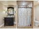 Charming bathroom featuring a tiled shower and a decorative vanity with granite countertop at 3130 Kates Nw Way, Kennesaw, GA 30152