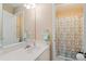 Bathroom with a white vanity, large mirror, and a shower with a patterned curtain at 3130 Kates Nw Way, Kennesaw, GA 30152