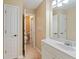 Inviting bathroom with a single sink vanity and easy access to a separate toilet room at 3130 Kates Nw Way, Kennesaw, GA 30152