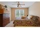 Cozy bedroom with neutral walls, carpeted floors, and natural light from the windows at 3130 Kates Nw Way, Kennesaw, GA 30152
