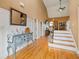 Inviting foyer with hardwood floors, high ceilings, staircase, and decorative mirror at 3130 Kates Nw Way, Kennesaw, GA 30152