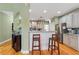 Well-equipped kitchen with stainless steel appliances, granite countertops, and breakfast bar at 3130 Kates Nw Way, Kennesaw, GA 30152