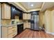 The kitchen has granite counters, stainless steel appliances, and custom cabinetry at 3130 Kates Nw Way, Kennesaw, GA 30152