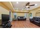 Cozy Living Room with recessed lights, ceiling fan, wood floors, and comfortable furniture at 3130 Kates Nw Way, Kennesaw, GA 30152