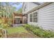 Spacious backyard with a covered seating area and lush landscaping at 114 Emily Ln, Alpharetta, GA 30009