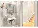 Charming powder room with unique sink and mirror at 114 Emily Ln, Alpharetta, GA 30009