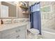 Updated bathroom featuring a marble vanity and a tiled shower at 114 Emily Ln, Alpharetta, GA 30009