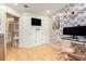 Charming bedroom with unique wallpaper, hardwood floors, and ample storage at 114 Emily Ln, Alpharetta, GA 30009