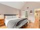 Cozy bedroom features a plush bed, stylish decor, and an en-suite bathroom with a glass shower door at 114 Emily Ln, Alpharetta, GA 30009