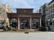 Charming exterior view of Cafe Intermezzo with ornate architecture and landscaping at 114 Emily Ln, Alpharetta, GA 30009